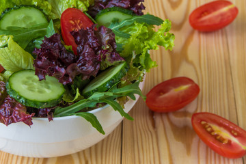 Fresh salad with mixed greens, cherry tomato and cucumber