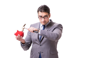 Naklejka premium Businessman breaking piggybank isolated white background