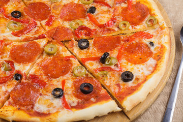 Pizza with sausage and olives.