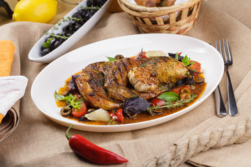 Grilled chicken with garlic and vegetables.