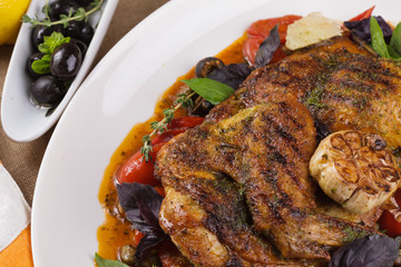 Grilled chicken with garlic and vegetables.