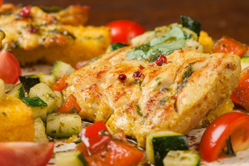 Grilled fish steak with stewed vegetables.