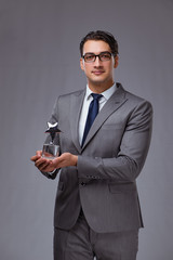 Businessman holding star award in business concept
