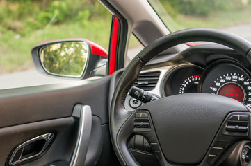 Car interior with steering wheel and dashboard