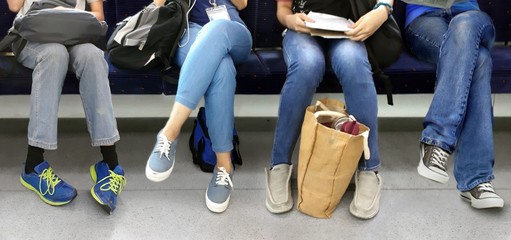People sitting inside subway train