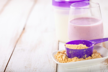 Protein and milk for milkshake. Sports food. Selective focus.