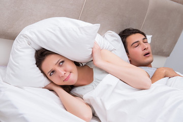 Woman having trouble with husband snoring