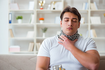 Young man suffering from sore throat