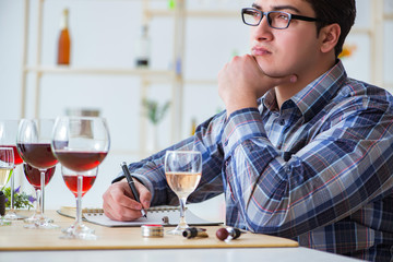Professional sommelier tasting red wine 