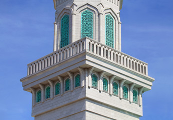 Detail of the minaret on the background of sky