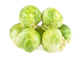 Pile of Brussels sprouts on a white background