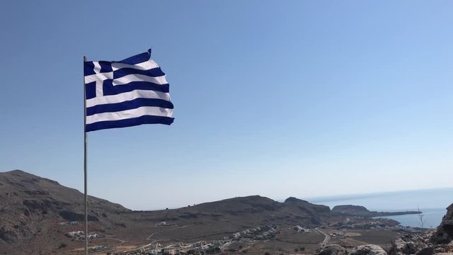 Greek Flag flying proudly above Pefkos, Rhodes, Greece