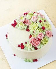 Birthday cake with flowers rose on light background
