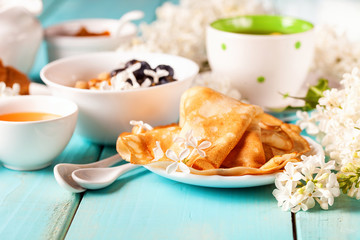 Breakfast - muesli, croissant, tea, jam, pancakes