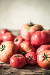 ripe Tomatoes on wooden background