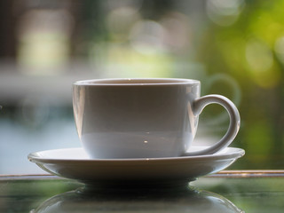 Cup of coffee on the table Background bokeh