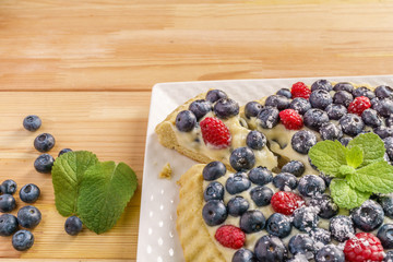 Dessert berry cake blueberry tart with fresh berries and pastry cream