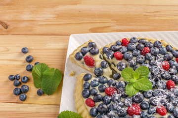 Dessert berry cake blueberry tart with fresh berries and pastry cream