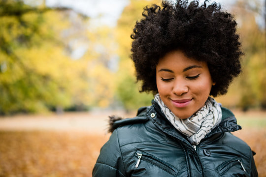 Shy Young Smiling Woman In Autumn Park