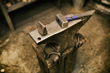 Blackmith tools in worksshop different pliers and hammers