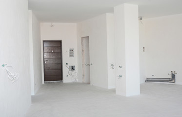 Empty room interior build with plastering wall, drywalls, stucco, metal door, wireless.