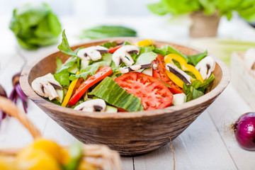 vegetable salad bowl on kitchen table, balanced diet