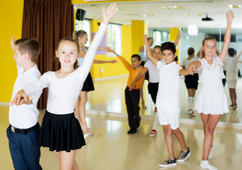 Fototapeta premium Boys and girls enjoying active dance