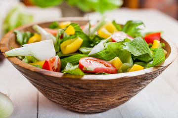 vegetable salad bowl on kitchen table, balanced diet