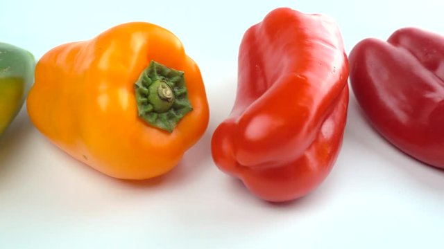 Sweet bell pepper on white background - (Green, yellow and red bell pepper)