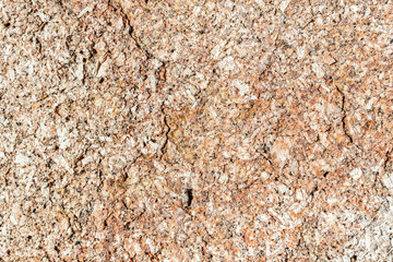 Rough detail of brown sand stone texture and background.