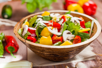 vegetable salad bowl on kitchen table, balanced diet