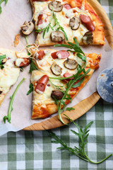 Homemade Pizza with sausages and mushrooms