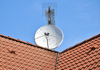 Satellite dish and television antenna on the roof