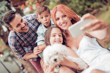 Family taking selfie with smart phone