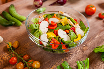 chicken salad bowl on kitchen table, balanced diet
