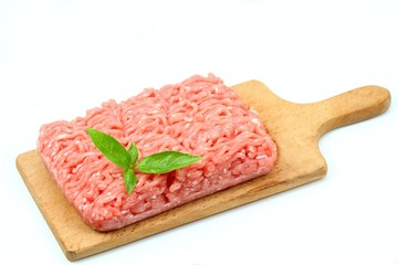 Raw minced pork, chopping board, white background