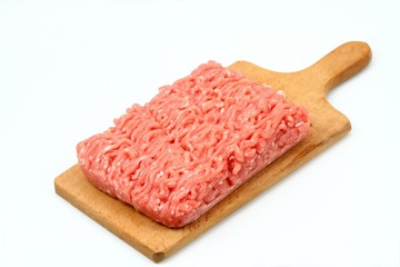 Raw minced pork, chopping board, white background