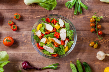healthy chicken salad in bowl, top view