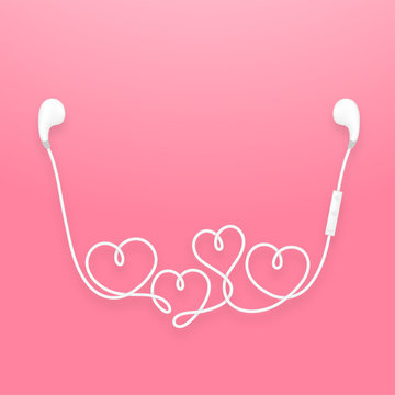 Earphones wireless and remote, earbud type white color and heart symbol made from cable isolated on pink gradient background, with copy space