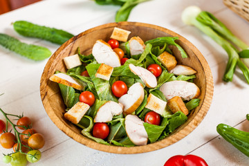 chicken salad bowl on kitchen table, balanced diet