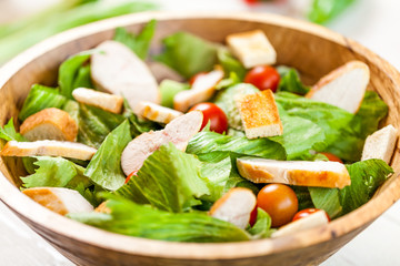 chicken salad bowl on kitchen table, balanced diet