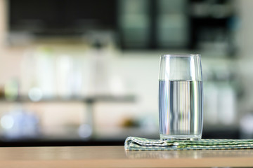 the Glass of purified water on the table bar in kitchenroom