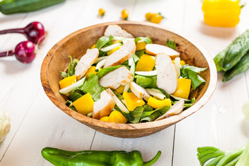chicken salad bowl on kitchen table, balanced diet