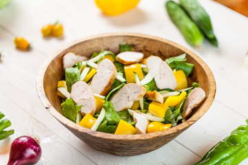 chicken salad bowl on kitchen table, balanced diet