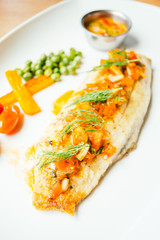 Grilled sea bass fish meat with sauce