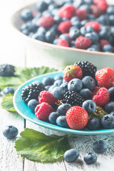different berries in bowl.