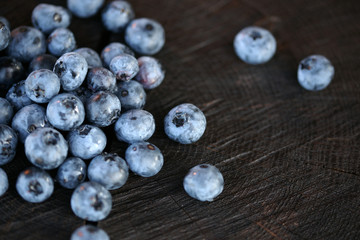 Blueberries on a dark wooden background