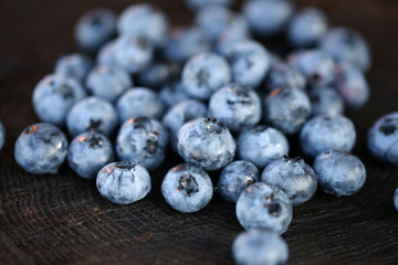 Blueberries on a dark wooden background