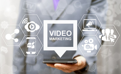 Video Marketing Online Business Mobile concept. Man offers smart phone with video marketing speech...