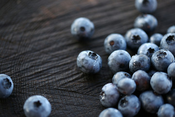 Blueberries on a dark wooden background